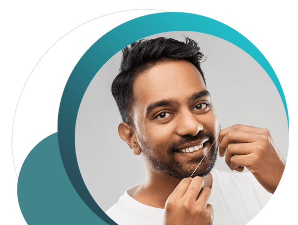 Man About to Floss Teeth to Prevent Gum Disease